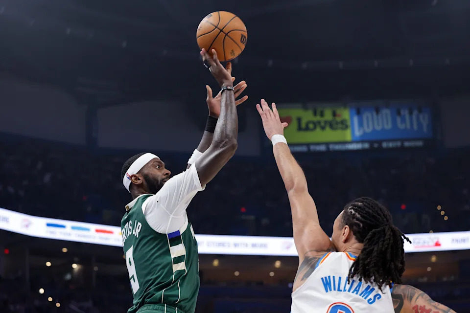 Feb 12, 2026; Oklahoma City, Oklahoma, USA; Milwaukee Bucks forward Bobby Portis (9) shoots a three point basket as Oklahoma City Thunder forward Jaylin Williams (6) defends during the first half at Paycom Center. Mandatory Credit: Alonzo Adams-Imagn Images