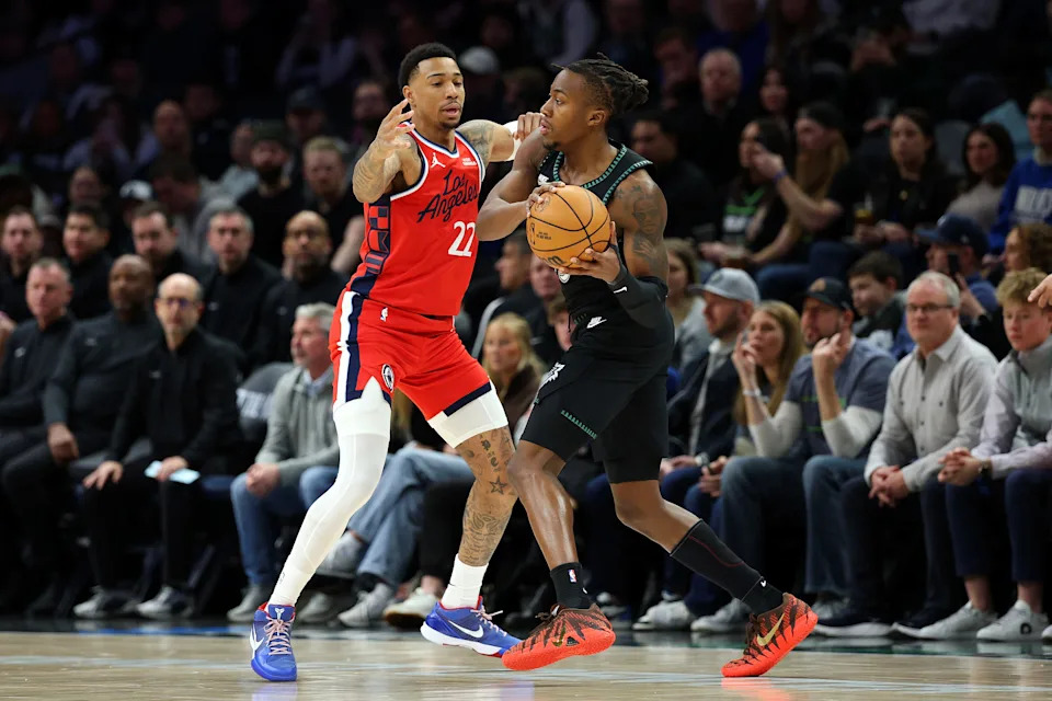 MINNEAPOLIS, MINNESOTA – FEBRUARY 08: Ayo Dosunmu #13 of the Minnesota Timberwolves handles the ball against Jordan Miller #22 of the Los Angeles Clippers in the first quarter at Target Center on February 08, 2026 in Minneapolis, Minnesota. NOTE TO USER: User expressly acknowledges and agrees that, by downloading and or using this photograph, User is consenting to the terms and conditions of the Getty Images License Agreement. (Photo by David Berding/Getty Images) | Getty Images