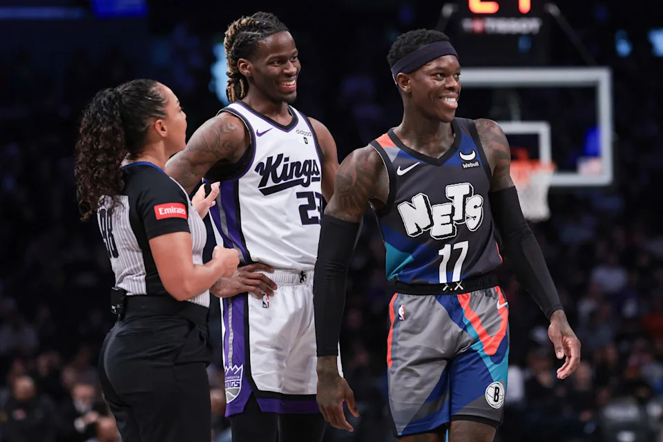 Former Brooklyn Nets guard Dennis Schroder (17) and ex-Sacramento Kings guard Keon Ellis (23) talk with referee Sha’Rae Mitchell (98) in a game at Barclays Center. Schroder and Ellis are now Cleveland Cavaliers teammates.