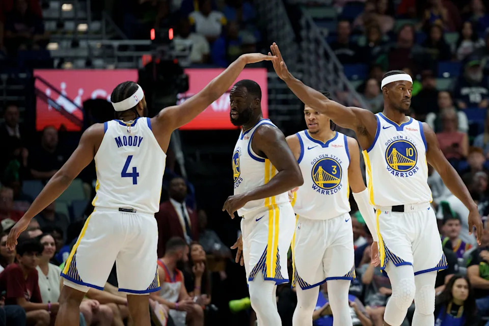 Nov 16, 2025; New Orleans, Louisiana, USA; Golden State Warriors guard Moses Moody (4) and forward Jimmy Butler III (10) celebrate next to forward Draymond Green (23) during the first half at Smoothie King Center. Mandatory Credit: Matthew Hinton-Imagn Images
