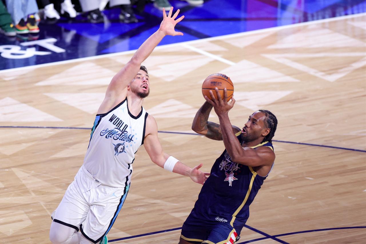 Kawhi Leonard #2 of the Los Angeles Clippers and Team USA Stripes (R) shoots against Alperen Sengun #28 of the Houston Rockets and Team World (L) during the 75th NBA All-Star Game at Intuit Dome in Inglewood, California, February 15, 2026  (AFP Photo)
