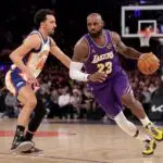 Los Angeles Lakers forward LeBron James (23) controls the ball against New York Knicks guard Landry Shamet (44) during the third quarter at Madison Square Garden on Feb 1, 2026.