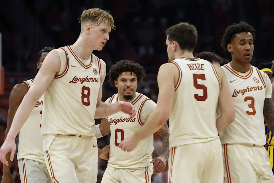 Texas guard Jordan Pope (0) as he and teammates guard Tramon Mark (12), center Matas Vokietaitis (8), forward Camden Heide (5) and forward Dailyn Swain celebrate a foul call late in the SEC college basketball game against LSU on Feb. 17, 2026, at Moody Center in Austin. (Icon Sportswire/Icon Sportswire via Getty Images)