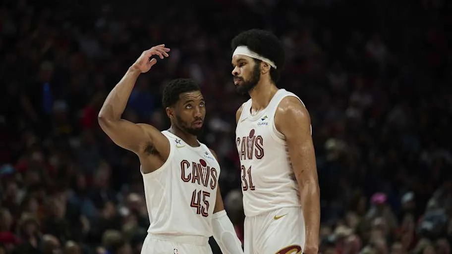Cleveland Cavaliers guard Donovan Mitchell talks to center Jarrett Allen
