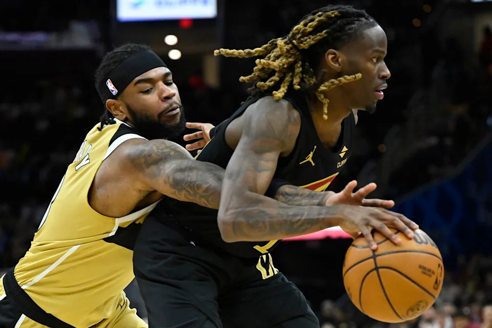 Cleveland Cavaliers guard Keon Ellis, right, is defended by Washington Wizards guard Jaden Hardy on Feb. 11, 2026, in Cleveland.
