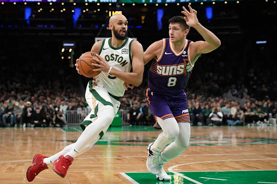 Mar 14, 2024; Boston, Massachusetts, USA; Boston Celtics guard Derrick White (9) drives to the basket past Phoenix Suns guard Grayson Allen (8) during the second half at TD Garden. Mandatory Credit: Bob DeChiara-USA TODAY Sports