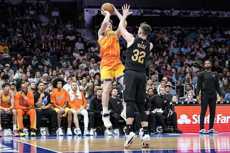 Charlotte Hornets guard Kon Knueppel (7) shoots over Cleveland Cavaliers forward Dean Wade (32) during the second half of an NBA basketball game, Friday, Feb. 20, 2026, in Charlotte, N.C.
