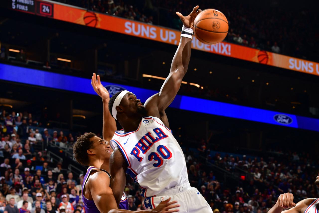 Adem Bona #30 of the Philadelphia 76ers grabs the rebound during the game against the Phoenix Suns at PHX Arena in Phoenix, Arizona, February 7, 2026. (AFP Photo)