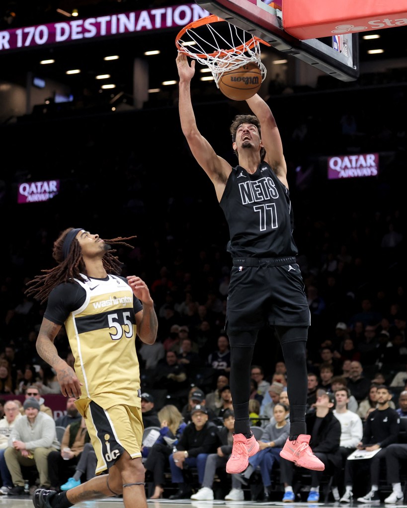 Brooklyn Nets guard Ben Saraf (77) dunks against Washington Wizards guard Keshon Gilbert (55).