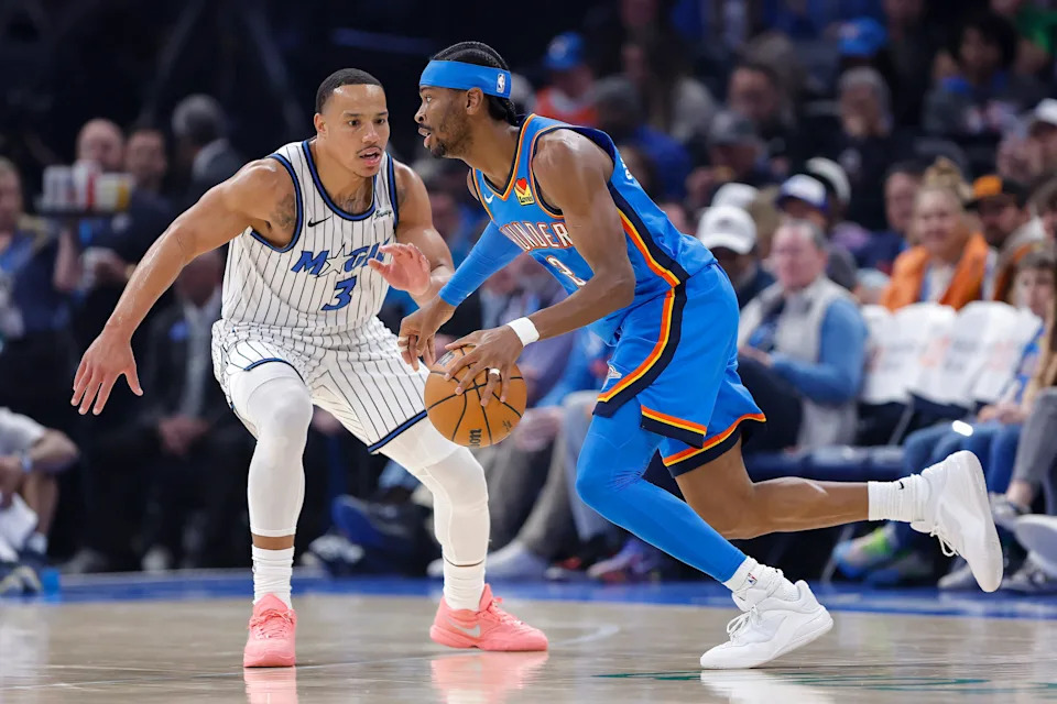 Feb 3, 2026; Oklahoma City, Oklahoma, USA; Oklahoma City Thunder guard Shai Gilgeous-Alexander (2) drives past Orlando Magic guard Desmond Bane (3) during the first quarter at Paycom Center. Mandatory Credit: Alonzo Adams-Imagn Images