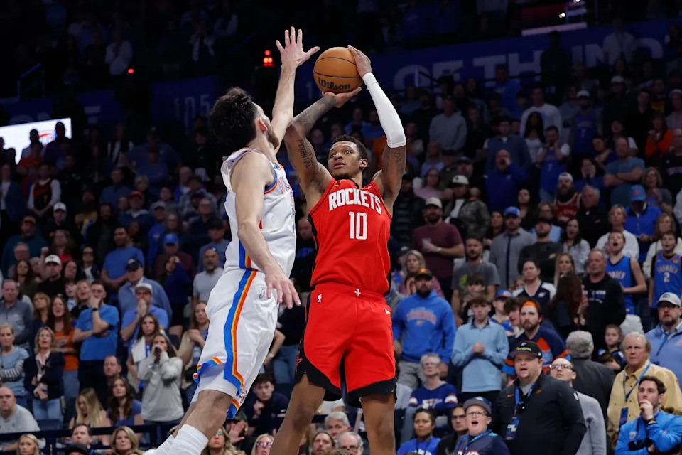 Feb 7, 2026; Oklahoma City, Oklahoma, USA; Houston Rockets forward Jabari Smith Jr. (10) shoots as Oklahoma City Thunder center/forward Chet Holmgren (7) defends during the second half at Paycom Center. Mandatory Credit: Alonzo Adams-Imagn Images