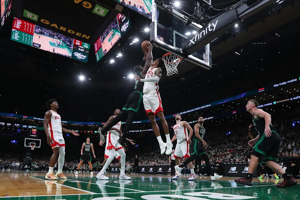 Nov 1, 2025; Boston, Massachusetts, USA; Houston Rockets forward Jabari Smith (10) blocks Boston Celtics forward Jaylen Brown (7) during the first half at TD Garden. Mandatory Credit: Paul Rutherford-Imagn Images