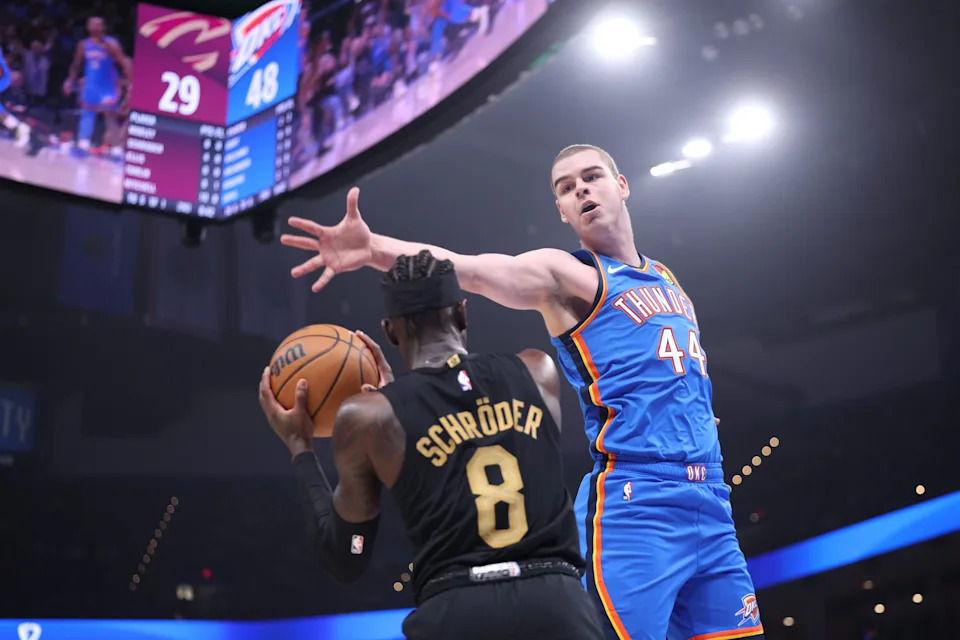 OKLAHOMA CITY, OKLAHOMA - FEBRUARY 22: Nikola Topic #44 of the Oklahoma City Thunder blocks a shot by Dennis Schroder #8 of the Cleveland Cavaliers during the first half at Paycom Center on February 22, 2026 in Oklahoma City, Oklahoma. NOTE TO USER: User expressly acknowledges and agrees that, by downloading and or using this photograph, User is consenting to the terms and conditions of the Getty Images License Agreement. (Photo by William Purnell/Getty Images)