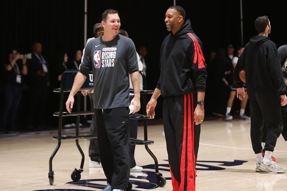 Former Laker Luke Walton and NBA Hall of Famer Tracy McGrady share a laugh during NBA Rising Stars practice on February 13, 2026 in Inglewood, CA.