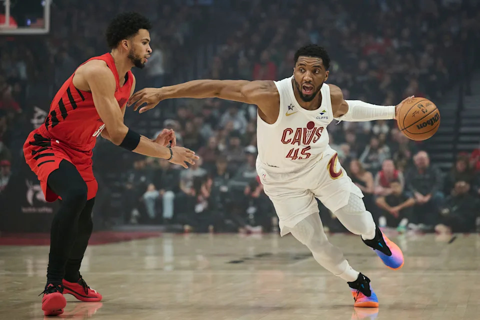 Cleveland Cavaliers guard Donovan Mitchell (45) drives to the basket past Portland Trail Blazers forward Toumani Camara (33) on Feb. 1, 2026, in Portland, Oregon.