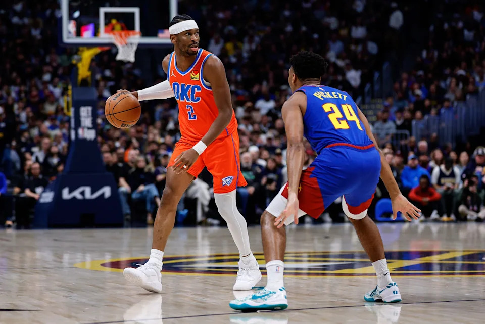 Feb 1, 2026; Denver, Colorado, USA; Oklahoma City Thunder guard Shai Gilgeous-Alexander (2) controls the ball as Denver Nuggets guard Jalen Pickett (24) guards in the first quarter at Ball Arena. Mandatory Credit: Isaiah J. Downing-Imagn Images