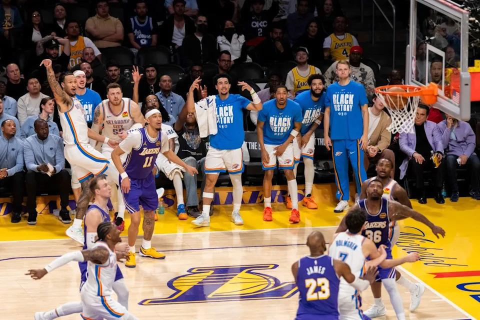 Jaylin Williams #6 of the Oklahoma City Thunder hits a three pointer in front of his bench during an NBA basketball game against the Los Angeles Lakers, Monday February 9, 2026 in Los Angeles, Calif.