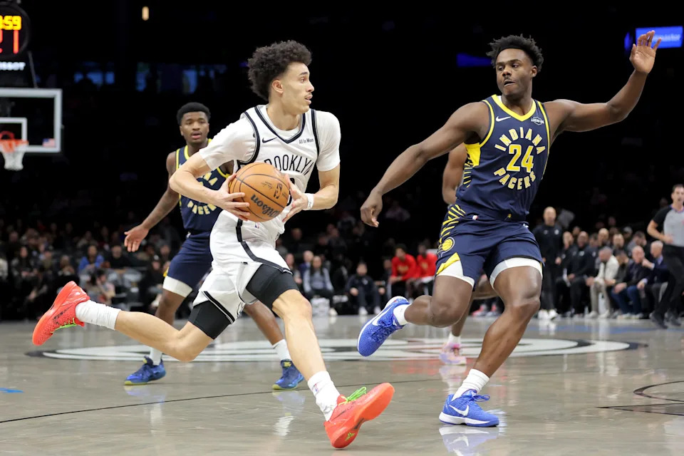 Feb 11, 2026; Brooklyn, New York, USA; Brooklyn Nets guard Nolan Traore (88) drives to the basket against Indiana Pacers guard Kobe Brown (24) during the first quarter at Barclays Center. Mandatory Credit: Brad Penner-Imagn Images