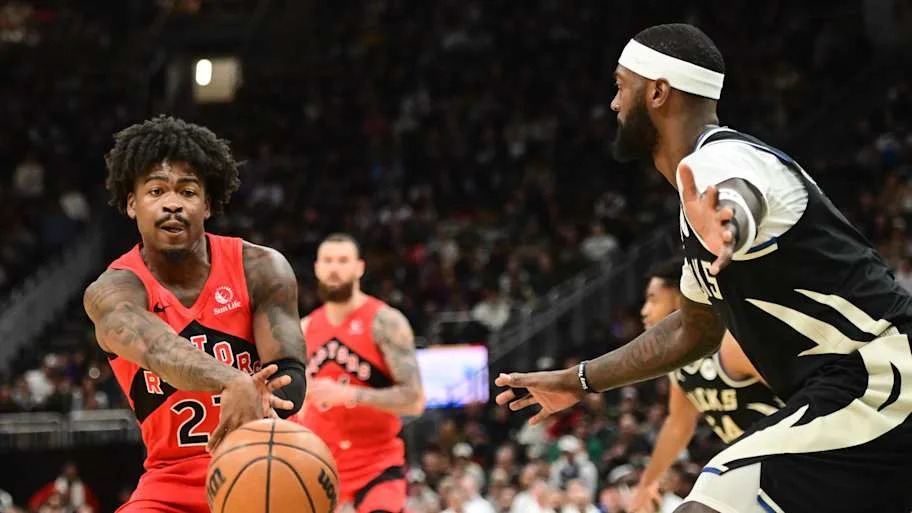 Toronto Raptors guard Jamal Shead passes the ball away from Milwaukee Bucks forward Bobby Portis
