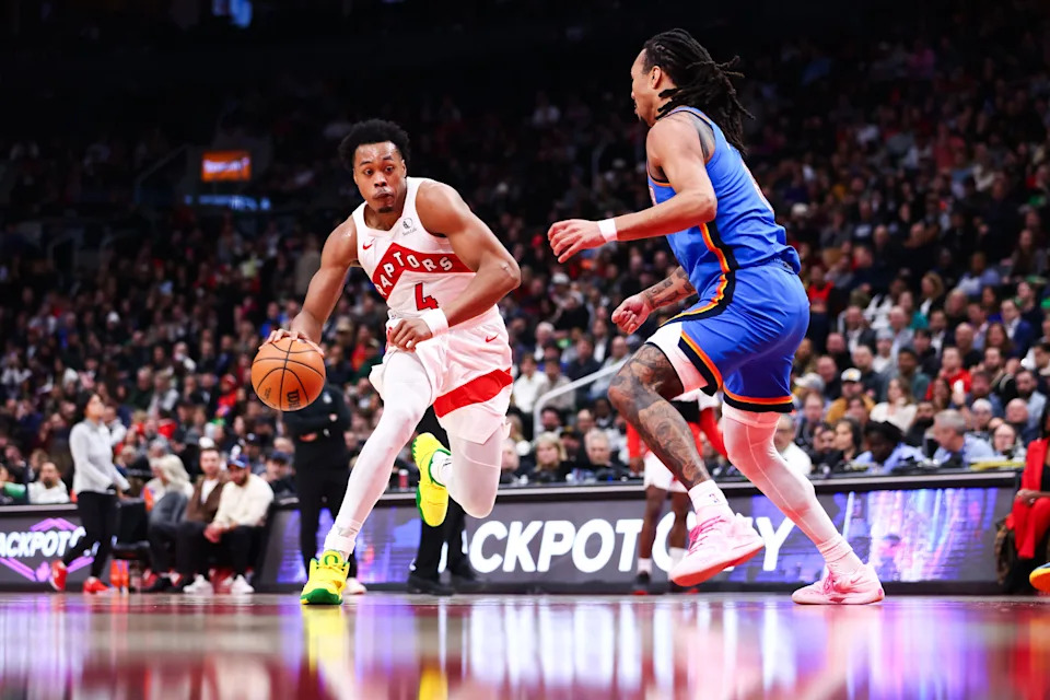 TORONTO, CANADA - FEBRUARY 24: Scottie Barnes #4 of the Toronto Raptors drives to the net against Jaylin Williams #6 of the Oklahoma City Thunder during the first half of their NBA game at Scotiabank Arena on February 24, 2026 in Toronto, Ontario, Canada. NOTE TO USER: User expressly acknowledges and agrees that, by downloading and or using this photograph, User is consenting to the terms and conditions of the Getty Images License Agreement. (Photo by Cole Burston/Getty Images)