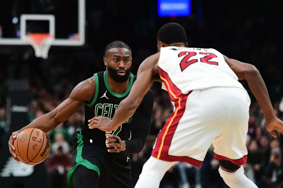 Feb 6, 2026; Boston, Massachusetts, USA; Boston Celtics guard Jaylen Brown (7) controls the ball while Miami Heat forward Andrew Wiggins (22) defends during the second half at TD Garden. Mandatory Credit: Bob DeChiara-Imagn Images