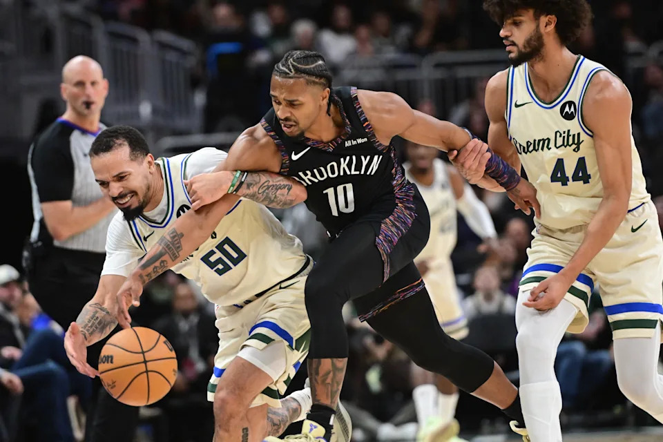 Nov 29, 2025; Milwaukee, Wisconsin, USA; Milwaukee Bucks guard Cole Anthony (50) and Brooklyn Nets guard Tyson Etienne (10) chase a loose ball in the fourth quarter at Fiserv Forum. Mandatory Credit: Benny Sieu-Imagn Images
