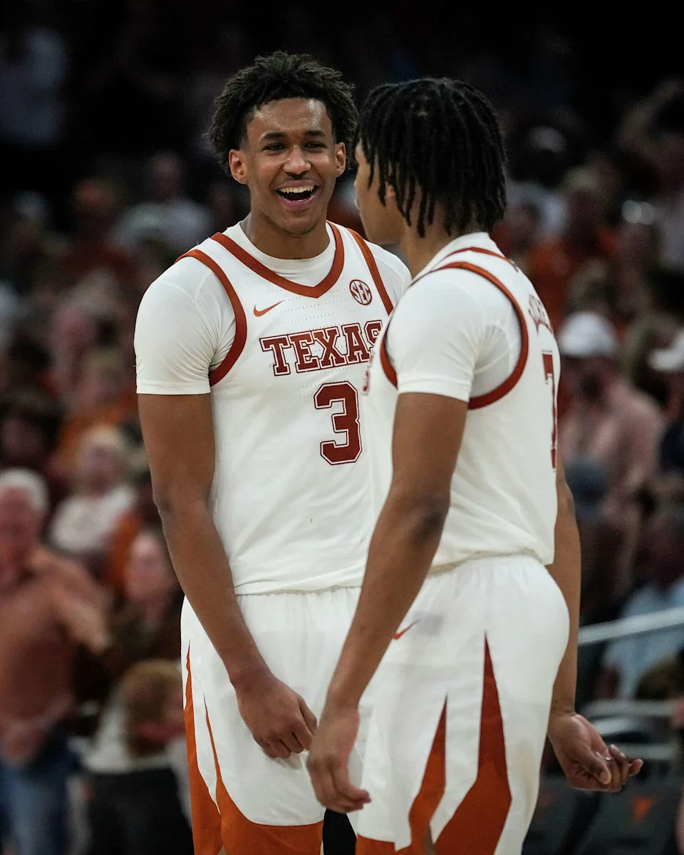 Texas Longhorns forward Dailyn Swain (3) and guard Simeon Wilcher (7) smile after a run of points in the second half of the Longhorns’ game against the Ole Miss Rebels at the Moody Center in Austin, Saturday, Feb. 7, 2026. Texas won the game 79-68. (Sara Diggins/Austin American-Statesman)