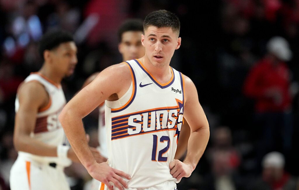 PORTLAND, OREGON - FEBRUARY 03: Collin Gillespie #12 of the Phoenix Suns looks on during the first half against the Portland Trail Blazers at Moda Center on February 03, 2026 in Portland, Oregon. (Photo by Soobum Im/Getty Images)