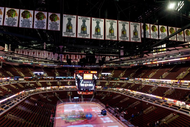 The Chicago Blackhawks Stanley Cup banners hang in front of Chicago Bulls banners in 2018 at the United Center. (Brian Cassella/Chicago Tribune)