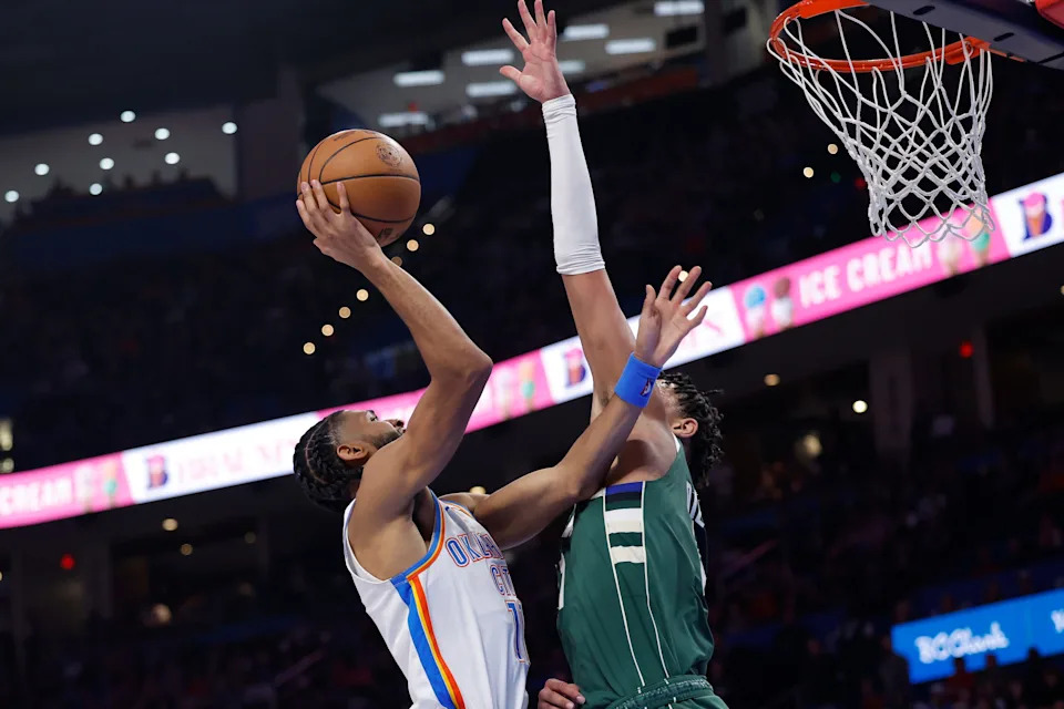 Feb 12, 2026; Oklahoma City, Oklahoma, USA; Oklahoma City Thunder guard Isaiah Joe (11) shoots against Milwaukee Bucks forward Ousmane Dieng (21) during the second half at Paycom Center. Mandatory Credit: Alonzo Adams-Imagn Images