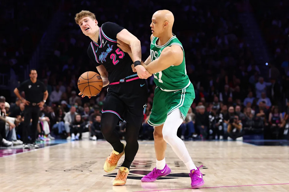 MIAMI, FLORIDA - JANUARY 15: Kasparas Jakucionis #25 of the Miami Heat makes a move against Jordan Walsh #27 of the Boston Celtics during the third quarter of the game at Kaseya Center on January 15, 2026 in Miami, Florida. NOTE TO USER: User expressly acknowledges and agrees that, by downloading and or using this photograph, User is consenting to the terms and conditions of the Getty Images License Agreement (Photo by Megan Briggs/Getty Images)