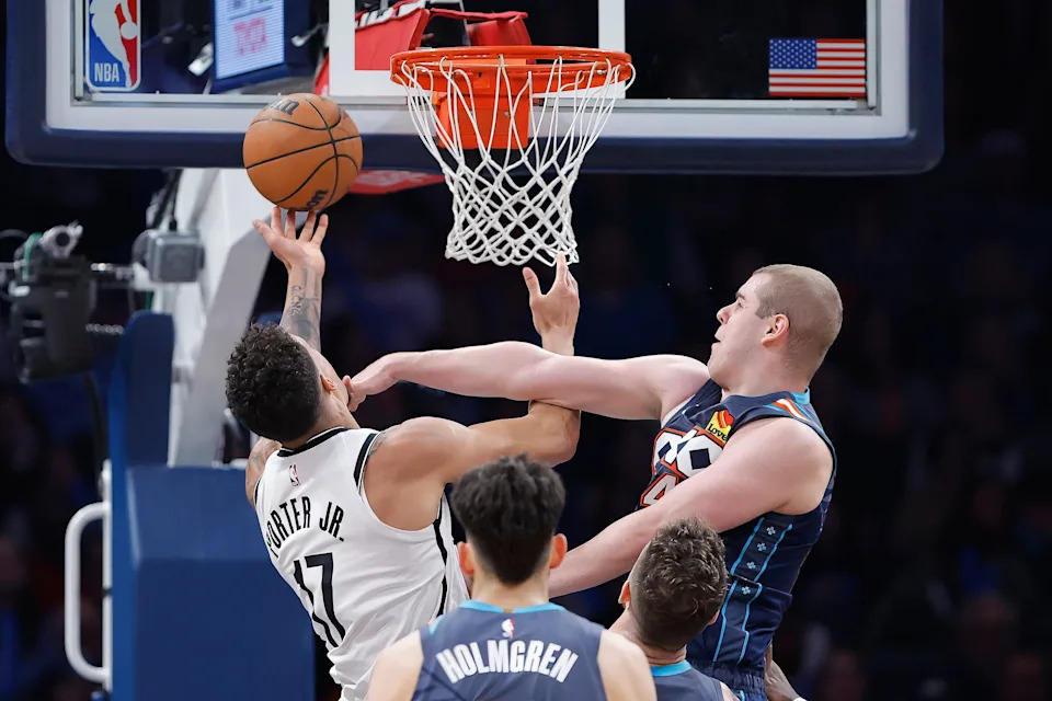 Feb 20, 2026; Oklahoma City, Oklahoma, USA; Oklahoma City Thunder guard Nikola Topić (44) fouls Brooklyn Nets forward Michael Porter Jr. (17) during the second half at Paycom Center. Mandatory Credit: Alonzo Adams-Imagn Images
