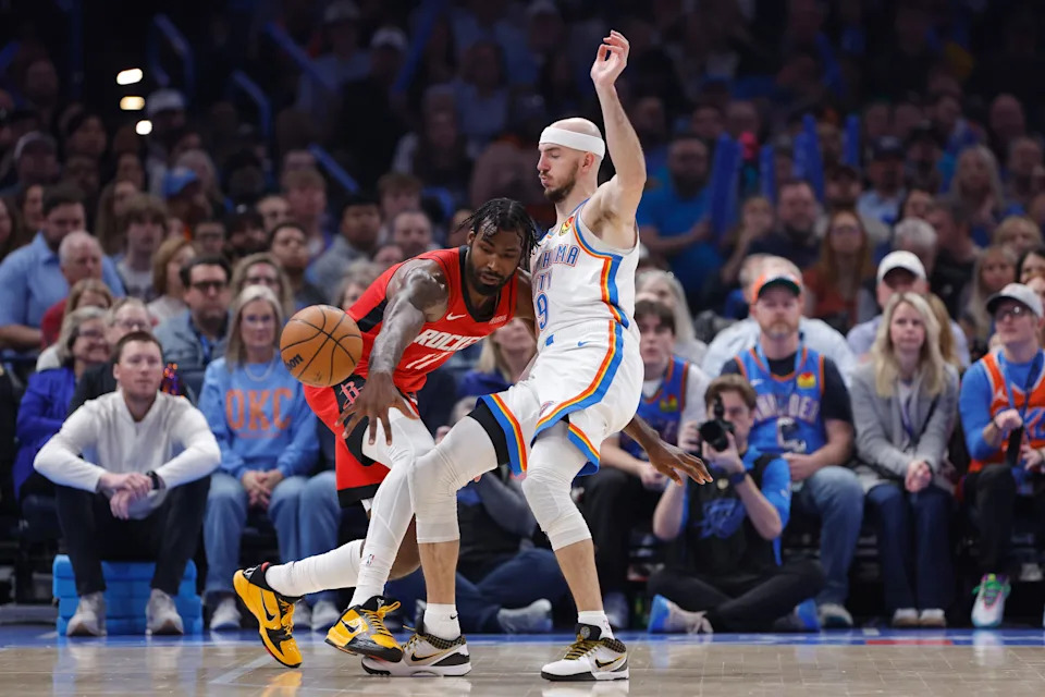 Feb 7, 2026; Oklahoma City, Oklahoma, USA; Houston Rockets forward Tari Eason (17) loses the ball on a drive against Oklahoma City Thunder guard Alex Caruso (9) during the first half at Paycom Center. Mandatory Credit: Alonzo Adams-Imagn Images