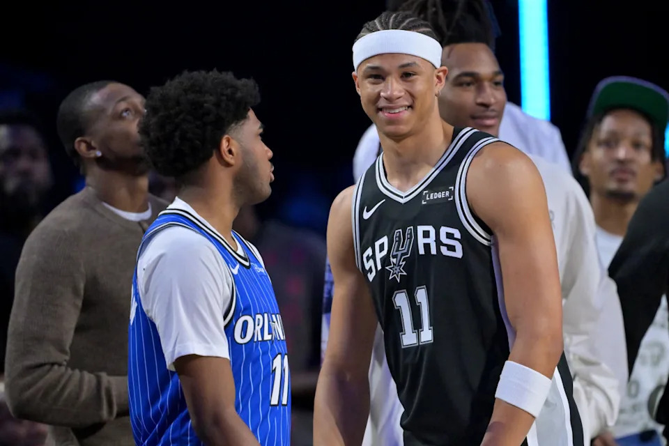 San Antonio Spurs forward Carter Bryant (11) and Orlando Magic guard Jase Richardson (11) look on during the NBA slam dunk contest.Jayne Kamin-Oncea-Imagn Images