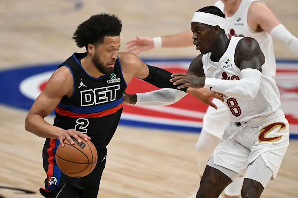 Detroit Pistons guard Cade Cunningham (2) tries to drive past Cleveland Cavaliers guard Dennis Schroder (8) on Feb. 27, 2026, in Detroit, Michigan.