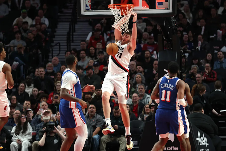 Feb 9, 2026; Portland, Oregon, USA; Portland Trail Blazers center Donovan Clingan (23) dunks the ball against the Philadelphia 76ers during the second half at Moda Center. Mandatory Credit: Jaime Valdez-Imagn Images