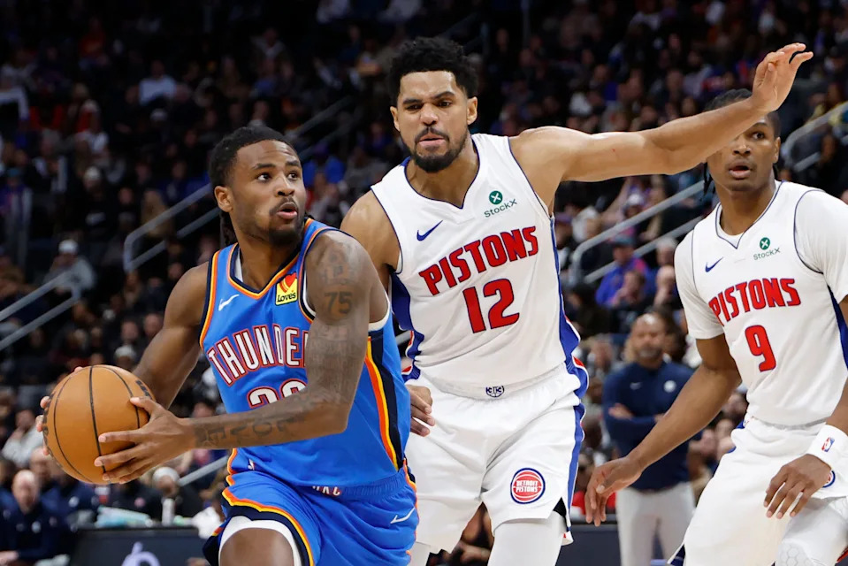 Feb 25, 2026; Detroit, Michigan, USA; Oklahoma City Thunder guard Cason Wallace (22) dribbles defended by Detroit Pistons forward Tobias Harris (12) in the second half at Little Caesars Arena. Mandatory Credit: Rick Osentoski-Imagn Images