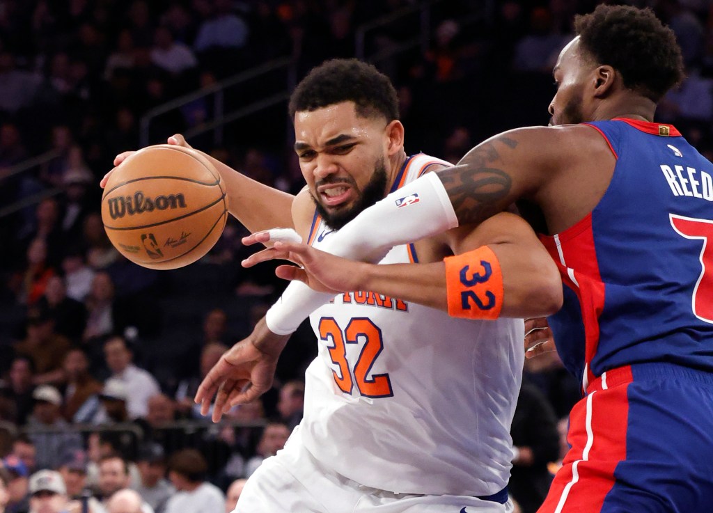 New York Knicks center Karl-Anthony Towns (32) drives to the basket as Detroit Pistons forward Paul Reed (7) defends.