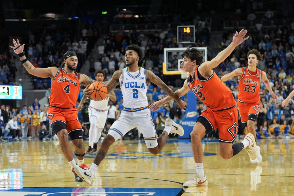 Donovan Dent driving for a game-winning basket, guarded by Kylan Boswell and Andrej Stojakovic.