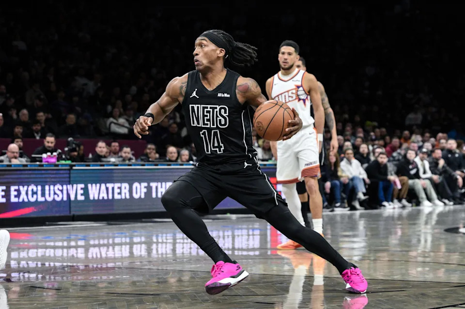 Jan 19, 2026; Brooklyn, New York, USA; Brooklyn Nets guard/forward Terance Mann (14) drives to the basket against the Phoenix Suns during the first half at Barclays Center. Mandatory Credit: John Jones-Imagn Images