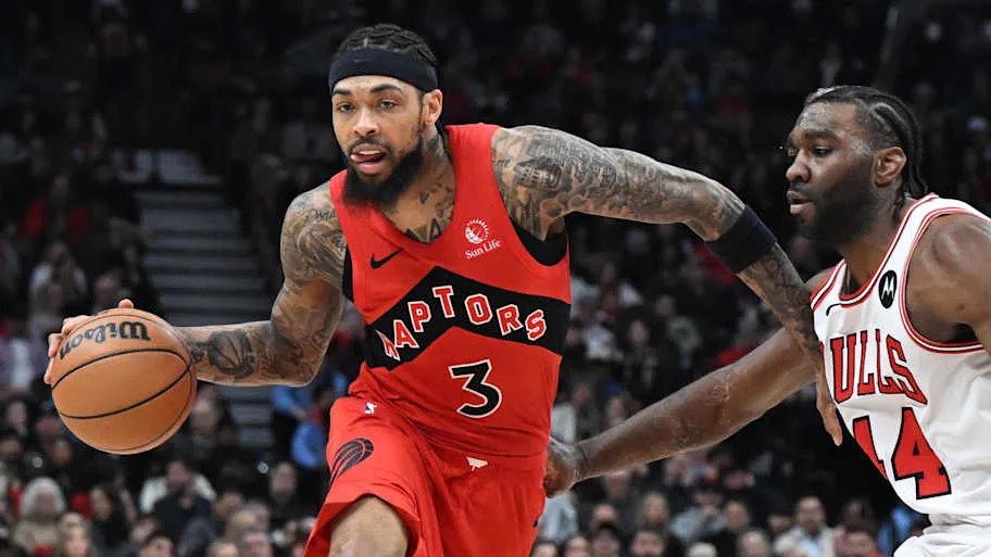 Toronto Raptors forward Brandon Ingram dribbles past Chicago Bulls forward Patrick Williams