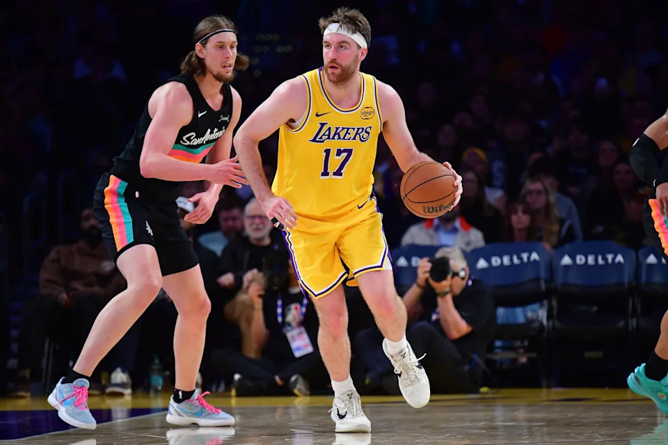 Feb 10, 2026; Los Angeles, California, USA; Los Angeles Lakers forward Drew Timme (17) moves the ball against San Antonio Spurs forward Kelly Olynyk (8) during the second half at Crypto.com Arena. Mandatory Credit: Gary A. Vasquez-Imagn Images