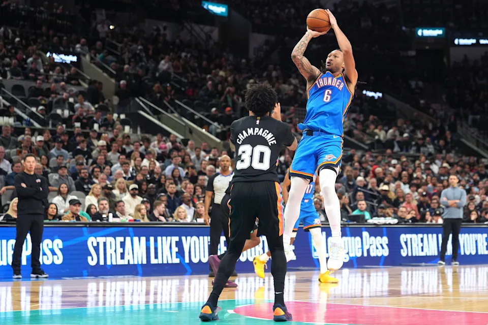 Feb 4, 2026; San Antonio, Texas, USA; Oklahoma City Thunder forward Jaylin Williams (6) shoots over San Antonio Spurs forward Julian Champagnie (30) during the second half at Frost Bank Center. Mandatory Credit: Scott Wachter-Imagn Images
