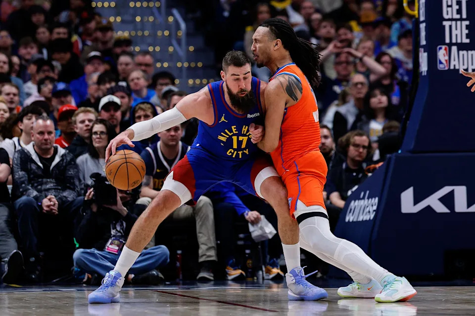 Feb 1, 2026; Denver, Colorado, USA; Denver Nuggets center Jonas Valanciunas (17) controls the ball as Oklahoma City Thunder forward Jaylin Williams (6) guards in the second quarter at Ball Arena. Mandatory Credit: Isaiah J. Downing-Imagn Images