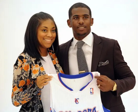 Los Angeles Clippers guard Chris Paul (right) and his wife Jada pose for a photo after today's press conference held at the team headquarters on Jul 10, 2013.