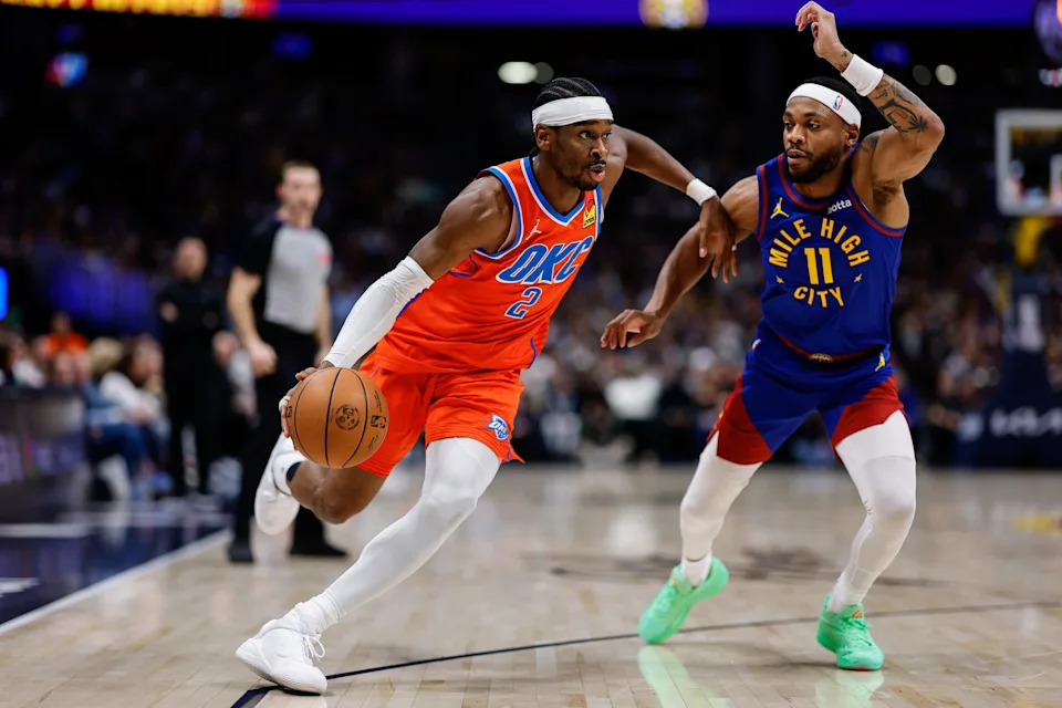 Feb 1, 2026; Denver, Colorado, USA; Oklahoma City Thunder guard Shai Gilgeous-Alexander (2) controls the ball as Denver Nuggets guard Bruce Brown (11) guards in the second quarter at Ball Arena. Mandatory Credit: Isaiah J. Downing-Imagn Images