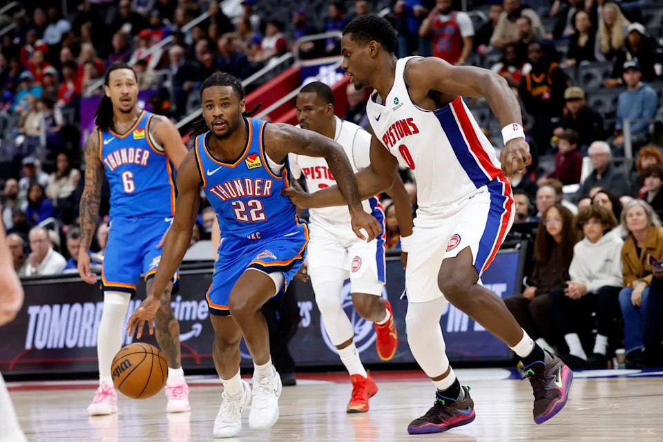 Feb 25, 2026; Detroit, Michigan, USA; Oklahoma City Thunder guard Cason Wallace (22) dribbles defended by Detroit Pistons center Jalen Duren (0) in the second half at Little Caesars Arena. Mandatory Credit: Rick Osentoski-Imagn Images
