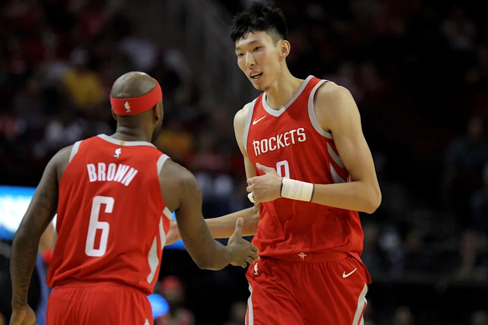 Oct 21, 2017; Houston, TX, USA; Houston Rockets center Zhou Qi (9, right) celebrates a basket with guard Bobby Brown (6) against the Dallas Mavericks during the fourth quarter at Toyota Center. Mandatory Credit: Erik Williams-USA TODAY Sports