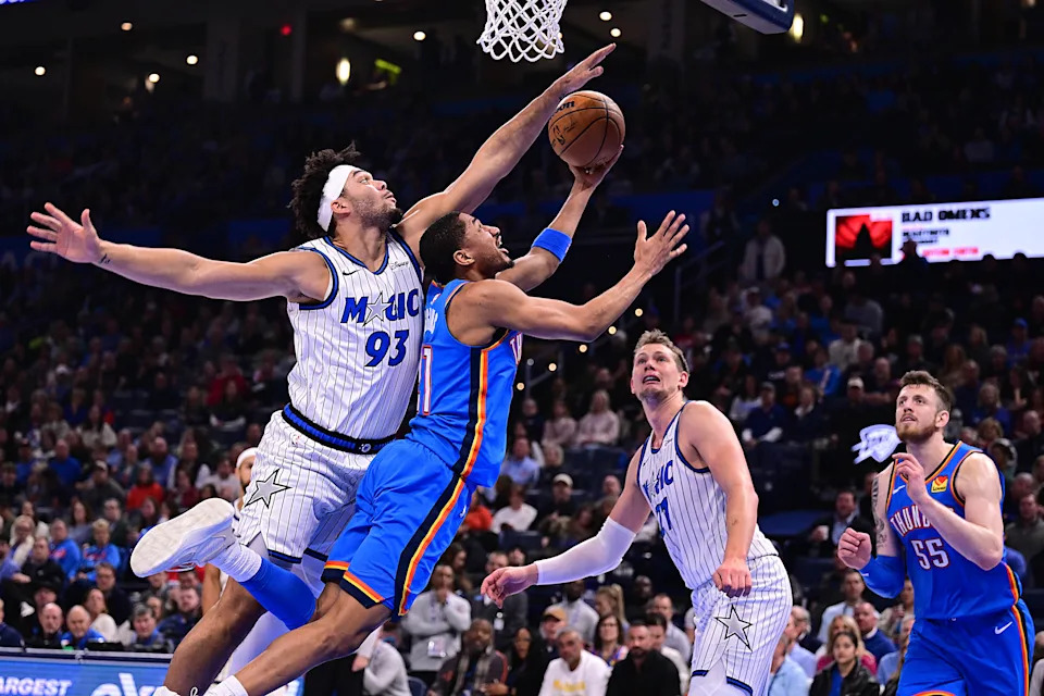 OKLAHOMA CITY, OKLAHOMA - FEBRUARY 3: Aaron Wiggins #21 of the Oklahoma City Thunder attempts a shot in front of Noah Penda #93 of the Orlando Magic during the first half at Paycom Center on February 3, 2026 in Oklahoma City, Oklahoma. NOTE TO USER: User expressly acknowledges and agrees that, by downloading and or using this photograph, User is consenting to the terms and conditions of the Getty Images License Agreement. (Photo by Joshua Gateley/Getty Images)