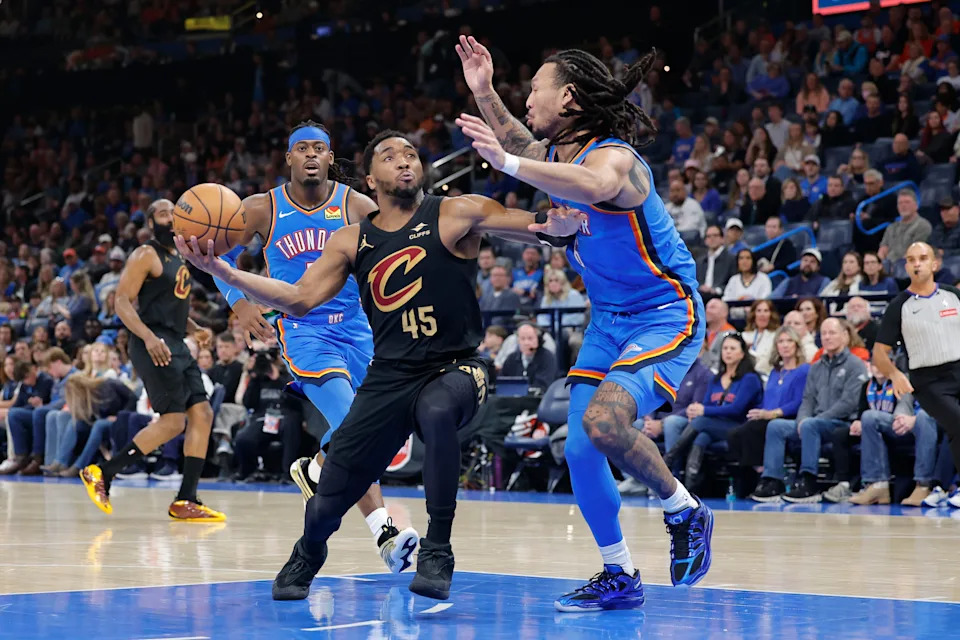 Feb 22, 2026; Oklahoma City, Oklahoma, USA; Cleveland Cavaliers guard Donovan Mitchell (45) drives to the basket as Oklahoma City Thunder forward Jaylin Williams (6) defends during the second half at Paycom Center. Mandatory Credit: Alonzo Adams-Imagn Images